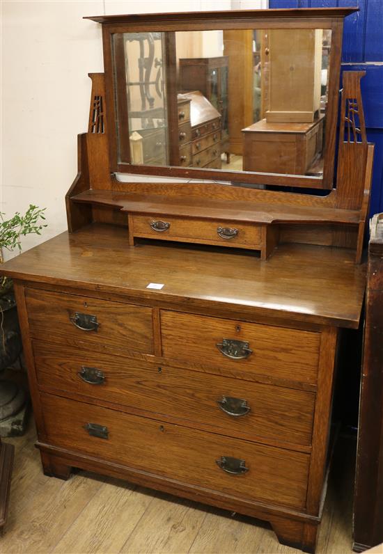 An Edwardian oak dressing chest W.107cm